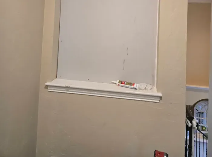 Finished interior walls with crown molding after drywall work